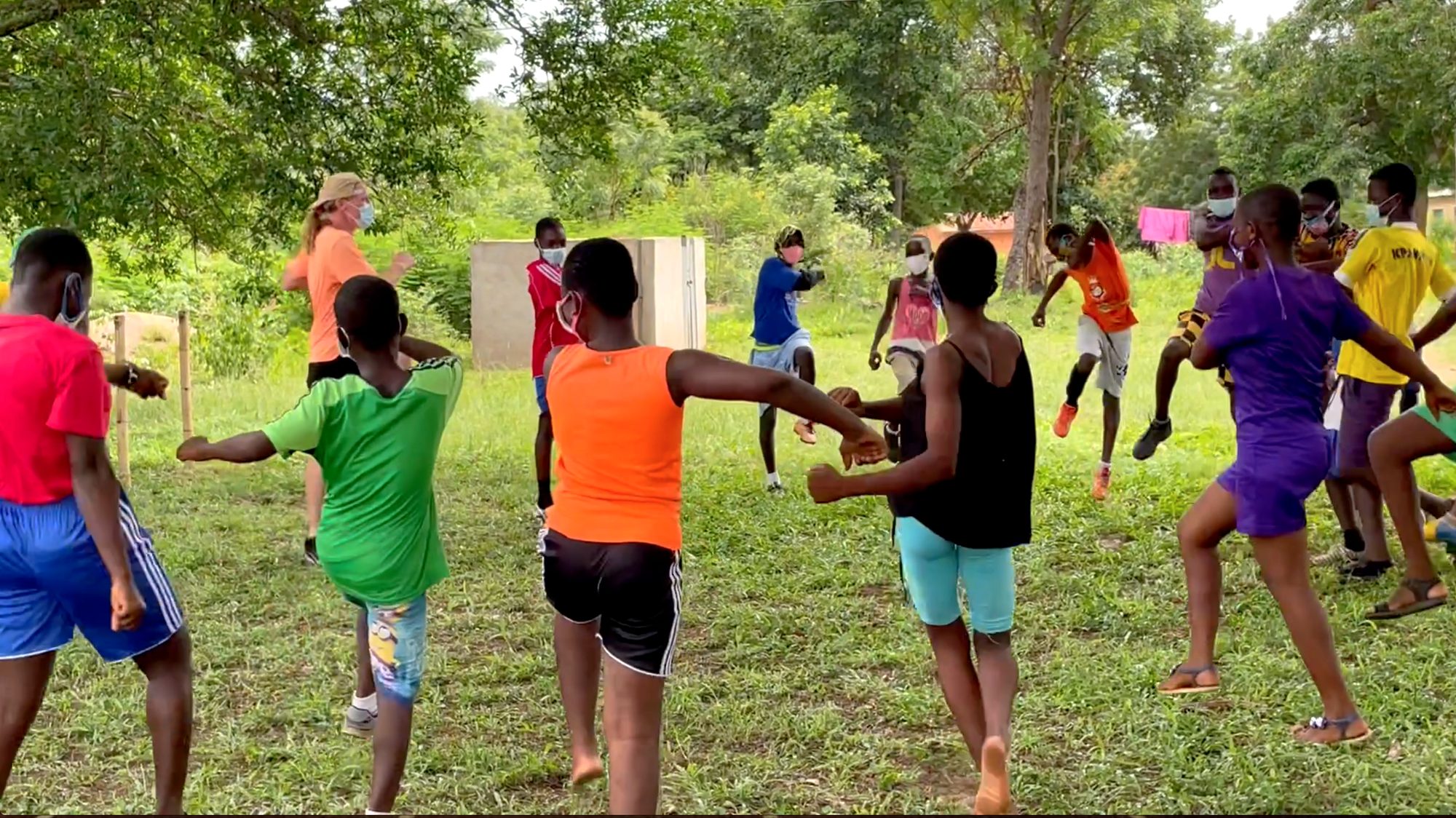 Children laughing and playing together during a Primally Playful program in Ghana