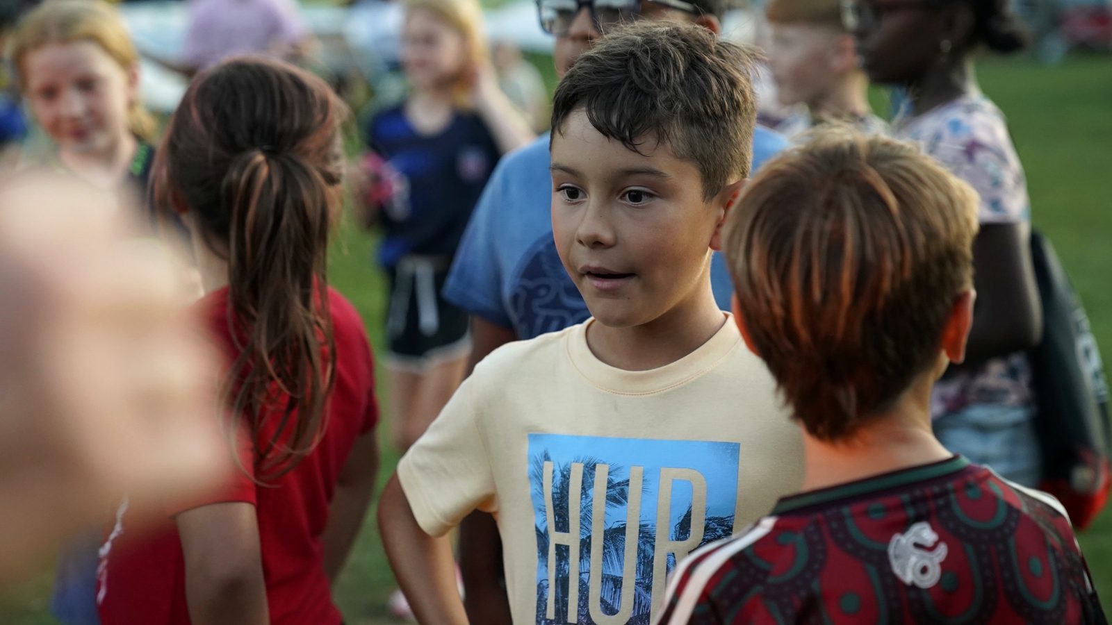 Kids connecting and talking at a community event